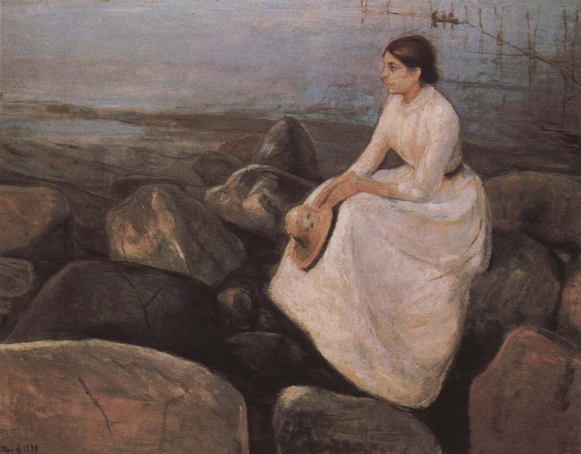 The girl  at the sea bank